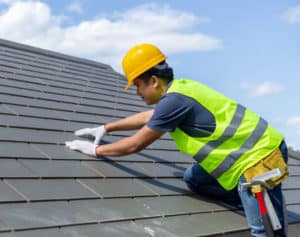 A roof inspector surveying a roof in phoenix AZ